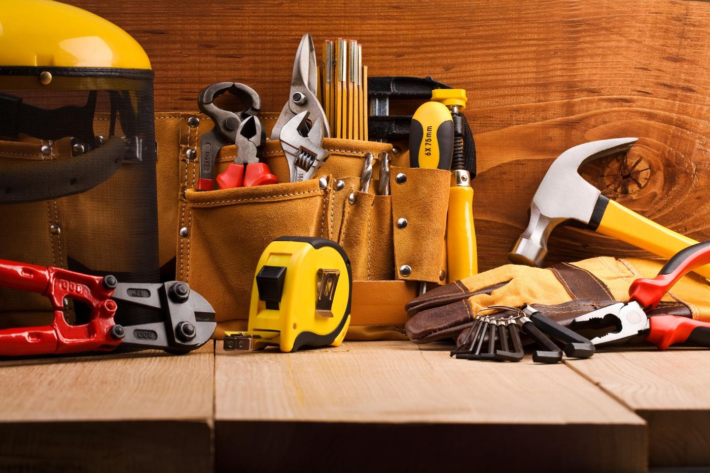 Handyman tools laid out on a workbench